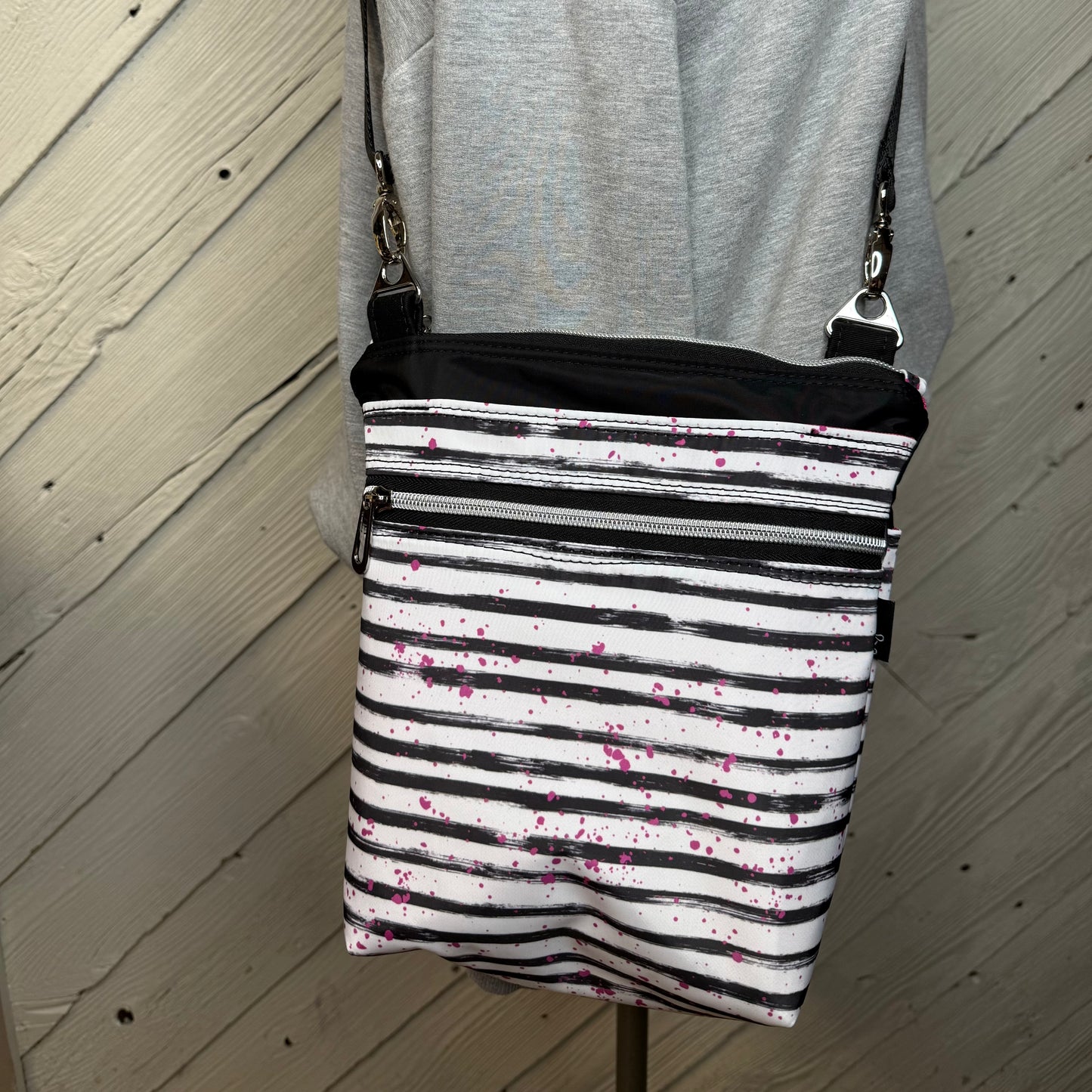 Crossbody Bag with black and white stripes with bright pink splashes