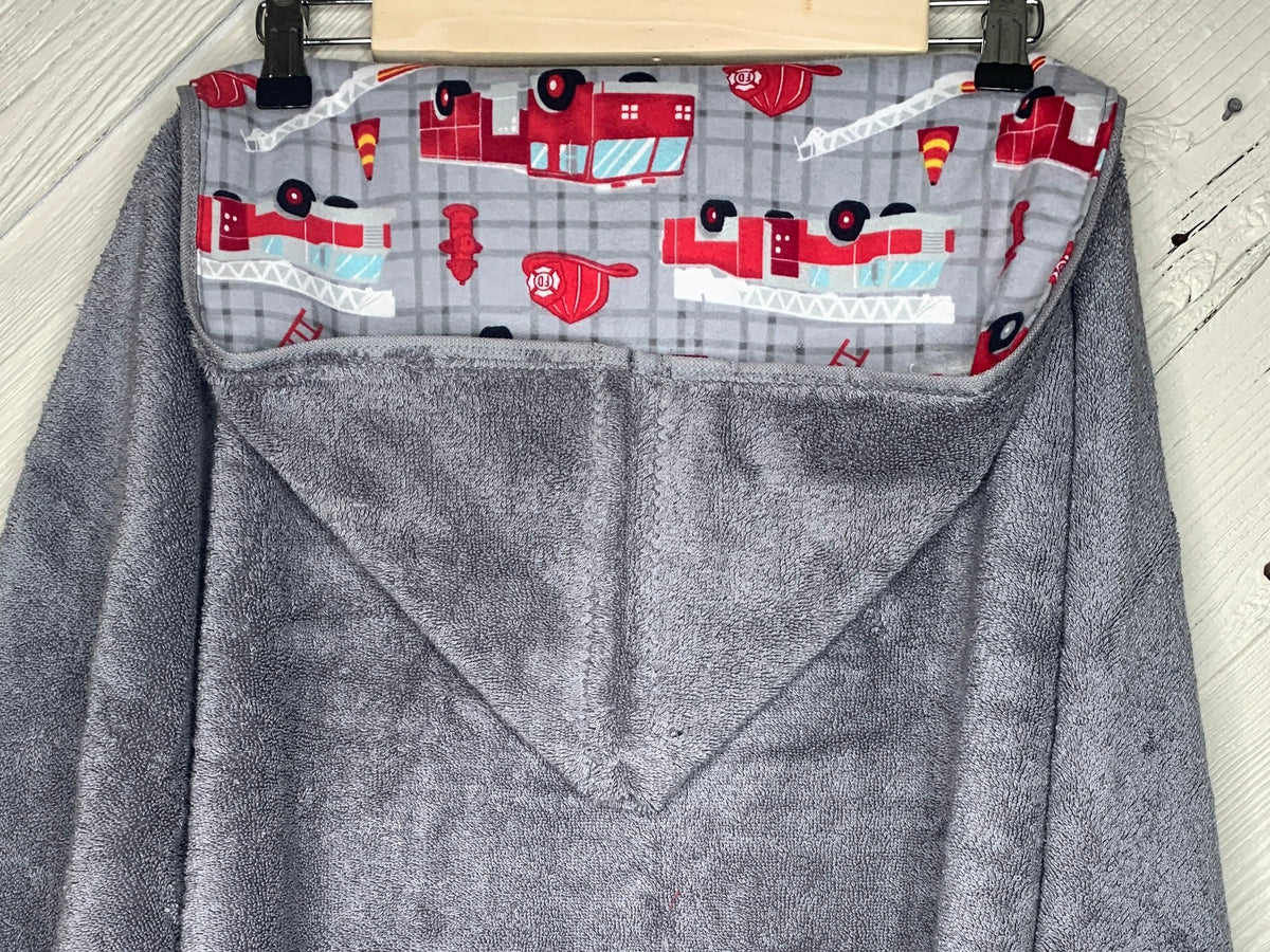 Hooded towel or hooded poncho towel with fire trucks