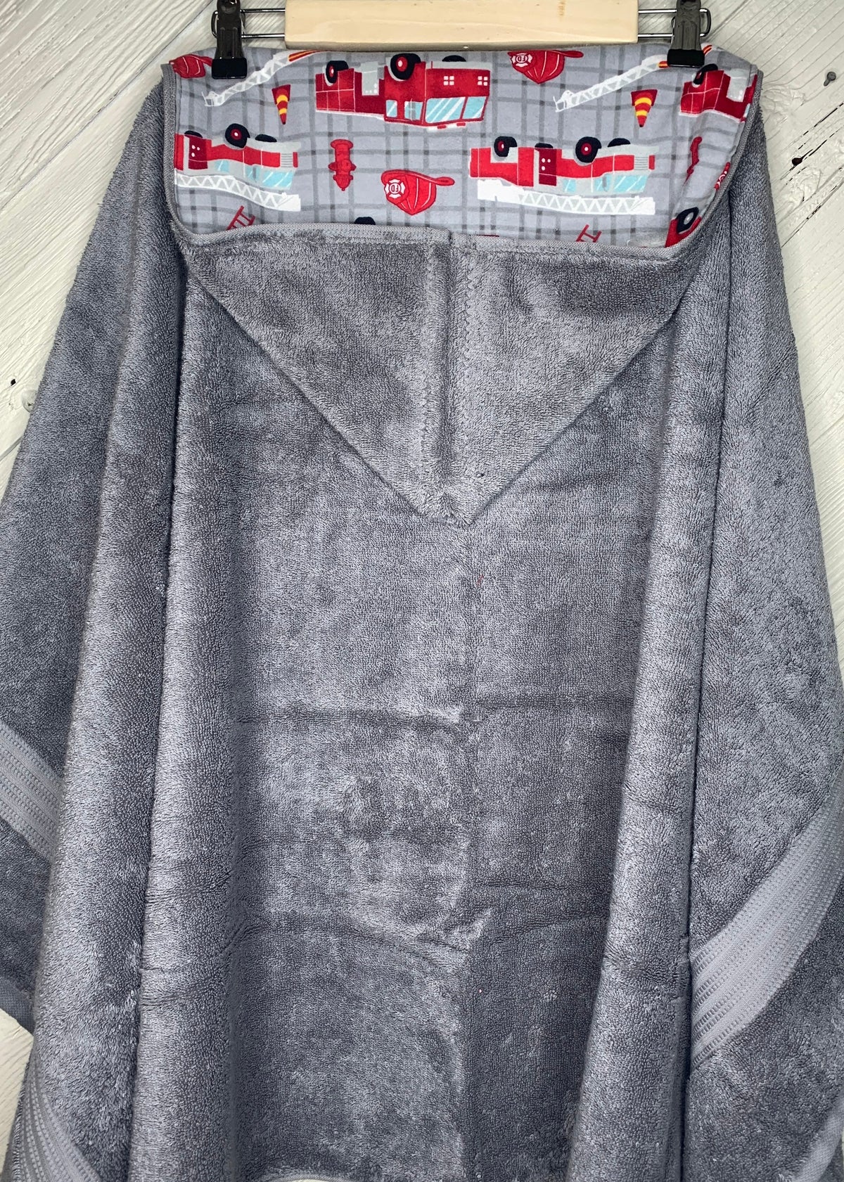 Hooded towel or hooded poncho towel with fire trucks