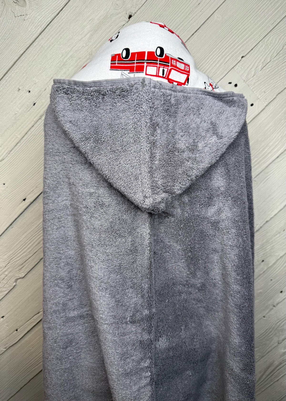 Hooded towel or hooded poncho towel with fire trucks